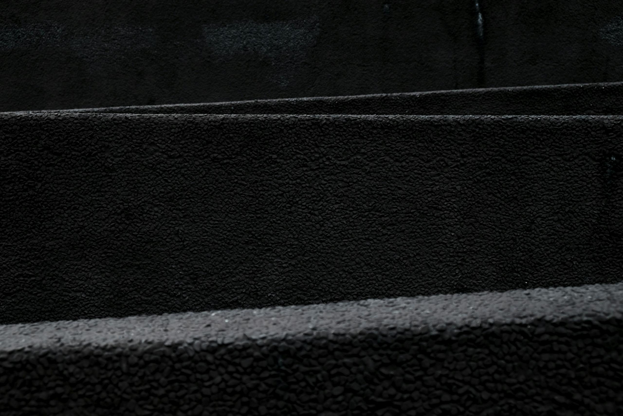 Sotwe A dark and minimalist black texture pattern ideal for backgrounds and design use.