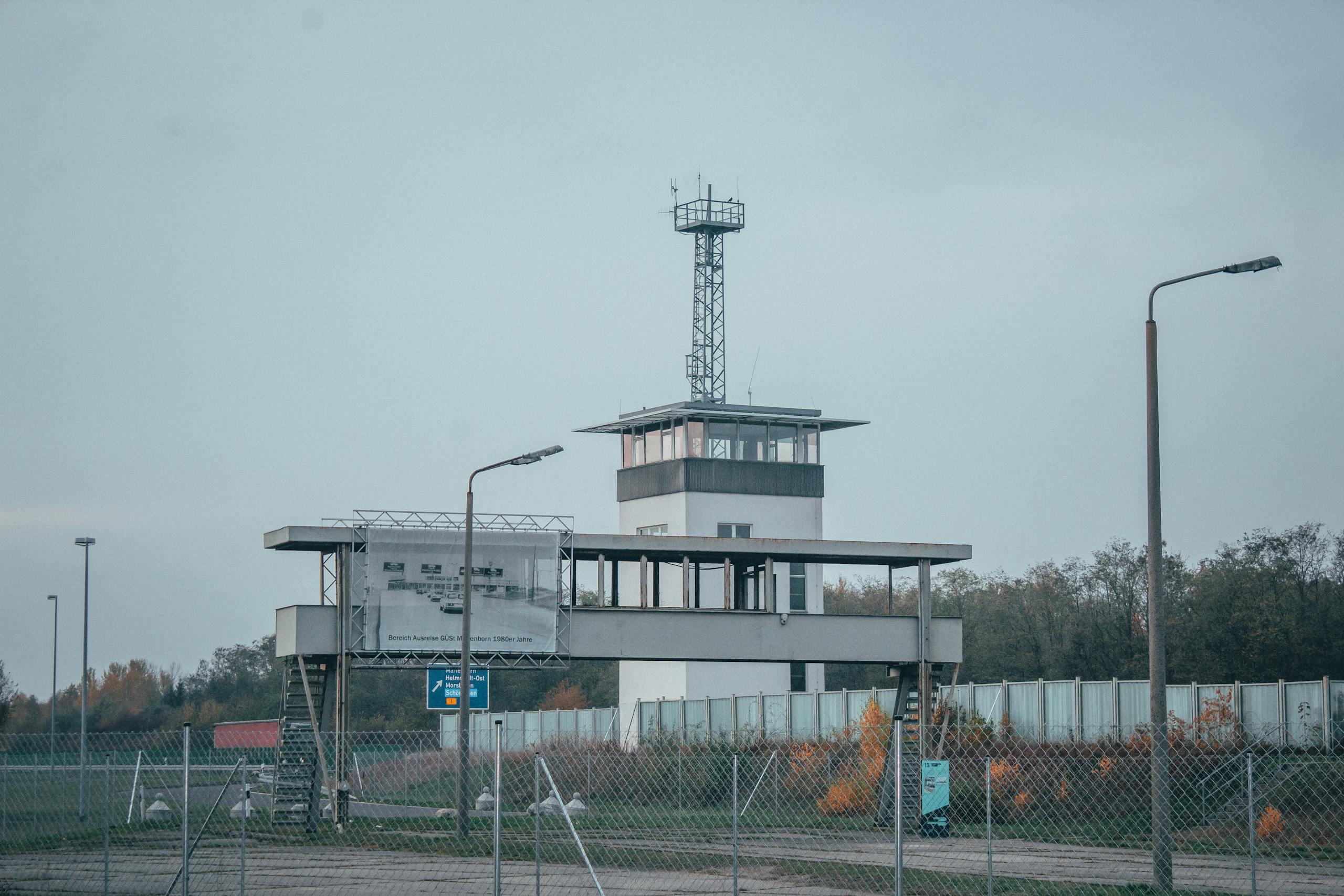 vRealize Infrastructure Navigator A modern control tower at an airport, surrounded by fences and street lamps.