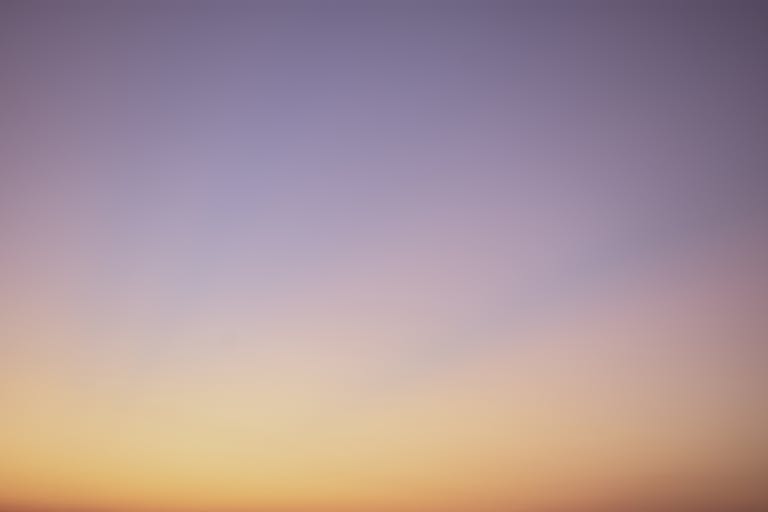 123safe67 A serene gradient sky with hues of blue, pink, and orange during twilight.