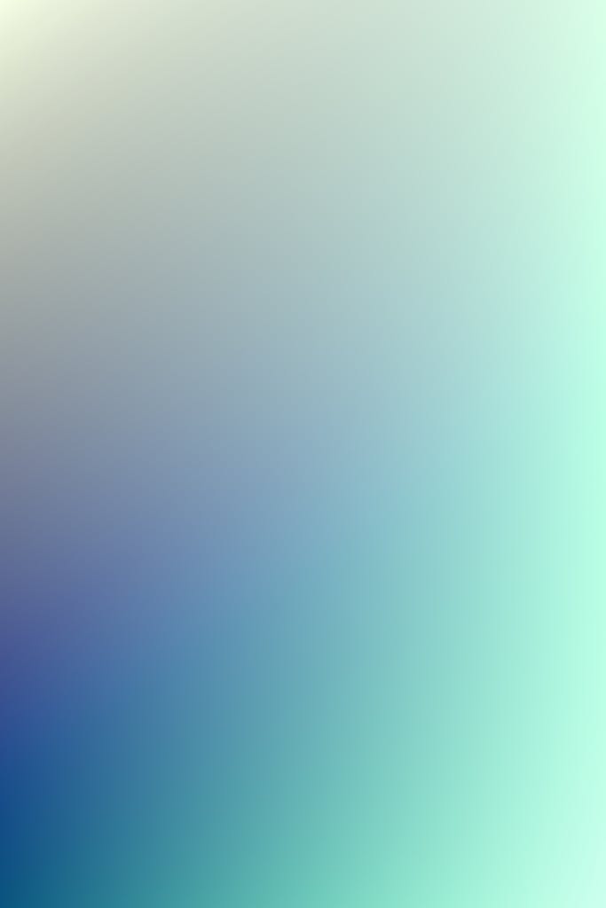 Permanentad A soothing gradient background with blue and green tones, perfect for digital screens.