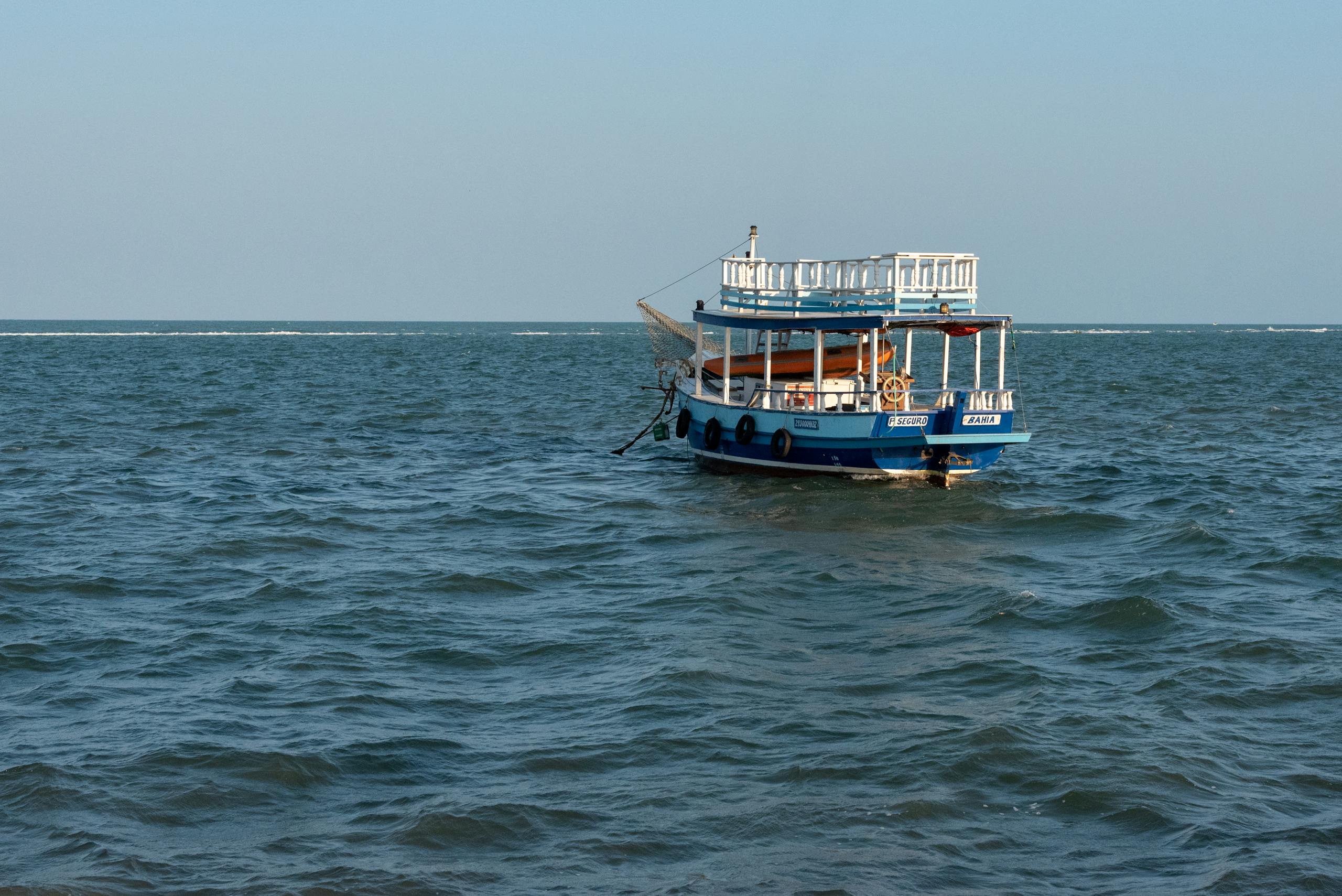 Fraboc A tranquil boat floating on the blue waters of Porto Seguro, Brazil.