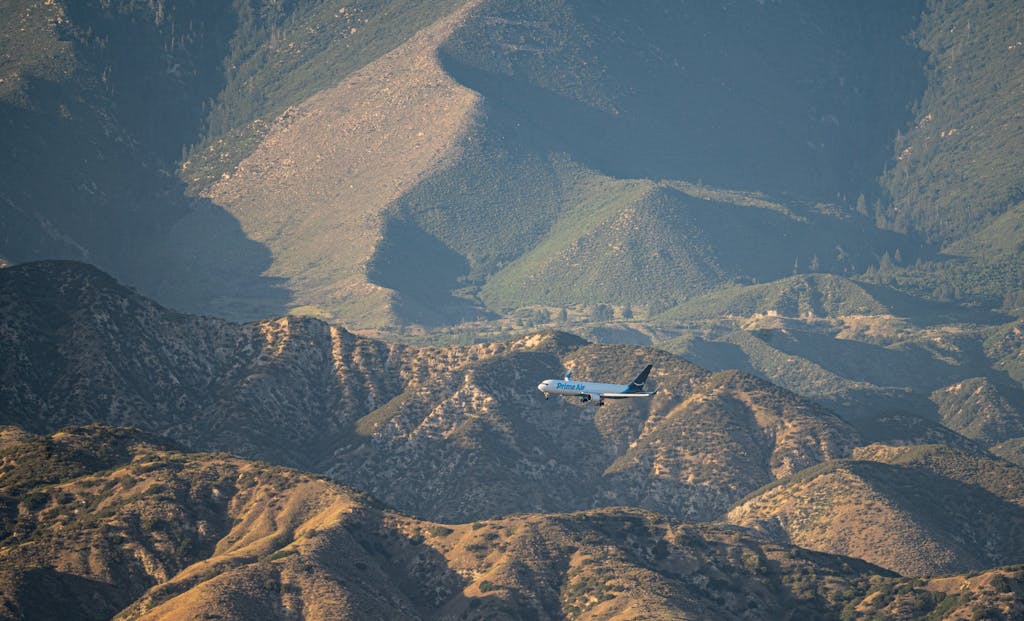 United Flight UA109 Diversion   Aerial view of an airliner flying over the scenic San Bernardino mountains near Redlands, California.