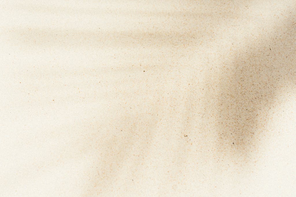  Kongotech.org: Artistic sand texture with natural shadows creating a serene abstract pattern, perfect for background use.