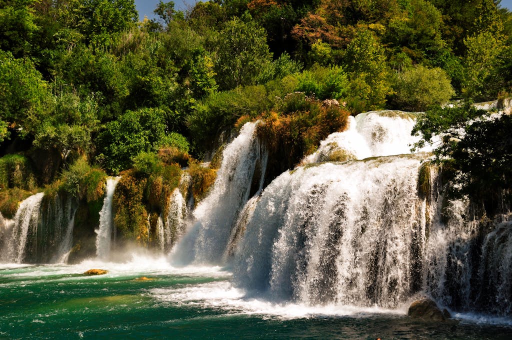 Valplekar Beautiful cascading waterfalls surrounded by lush greenery in a serene Croatian forest setting.