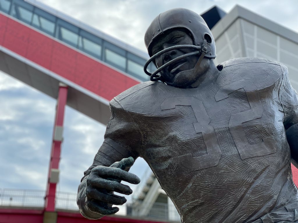 Bengals vs Cleveland Close-up of a football player statue outside a modern stadium in Cleveland, Ohio.