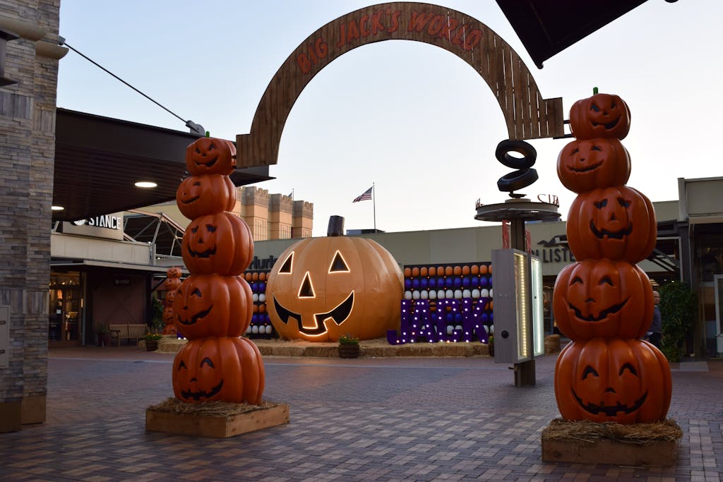 Shop Sunnylife Giant Jumbling Tower Festive Halloween entrance with large jack-o'-lanterns and archway in Commerce, California.