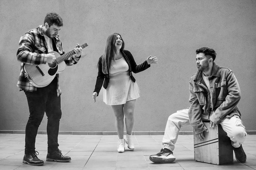 TRIOS 5 Invisalign Submission Street musicians in Buenos Aires performing with guitar, singing, and percussion in black and white.