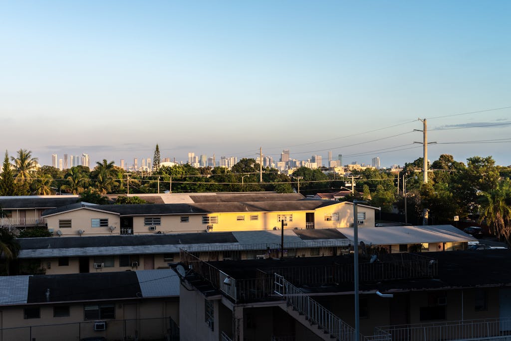 Inter Miami vs Tigres UANL Timeline View of Miami skyline from Coral Gables at sunset with residential buildings in foreground.