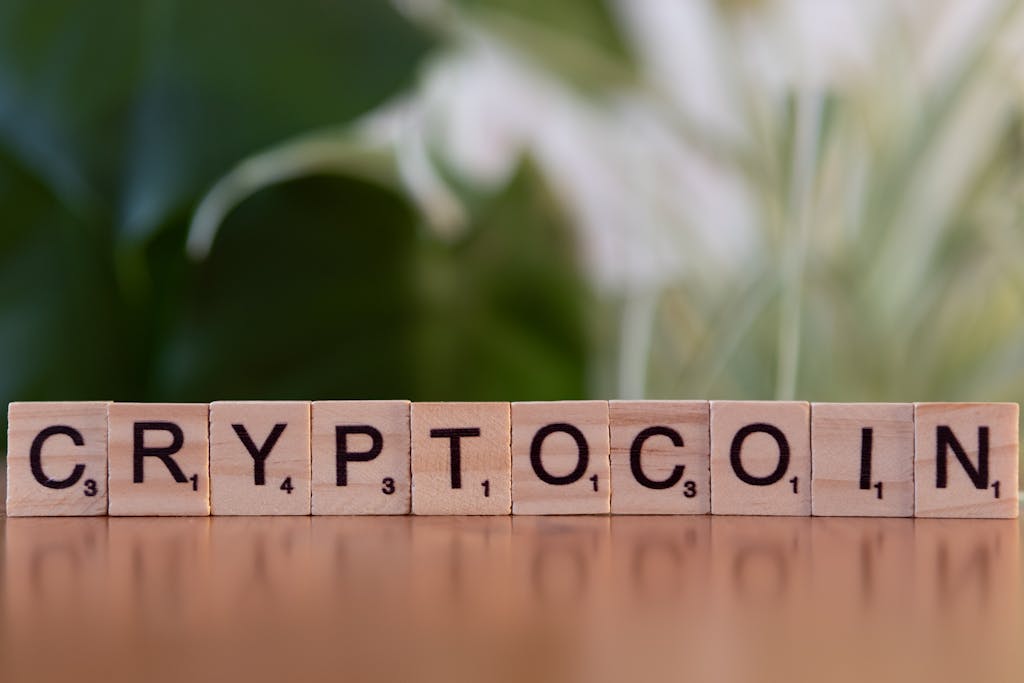 FintechAsia Wooden blocks spelling 'cryptocoin' representing digital currency concept.
